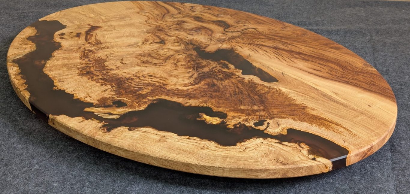 Confluence Chestnut and resin oval coffee table hand made in Northern Ireland