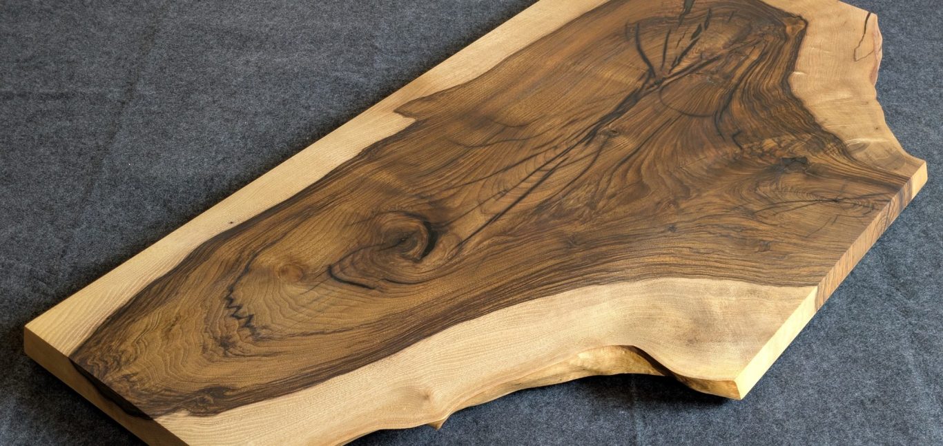Obsidian I walnut and resin live edge table by INSIGNI