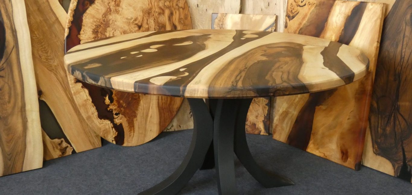 Eclipse - Walnut and resin dining table Walnut and resin 1400 diameter dining table hand made in Northern Ireland