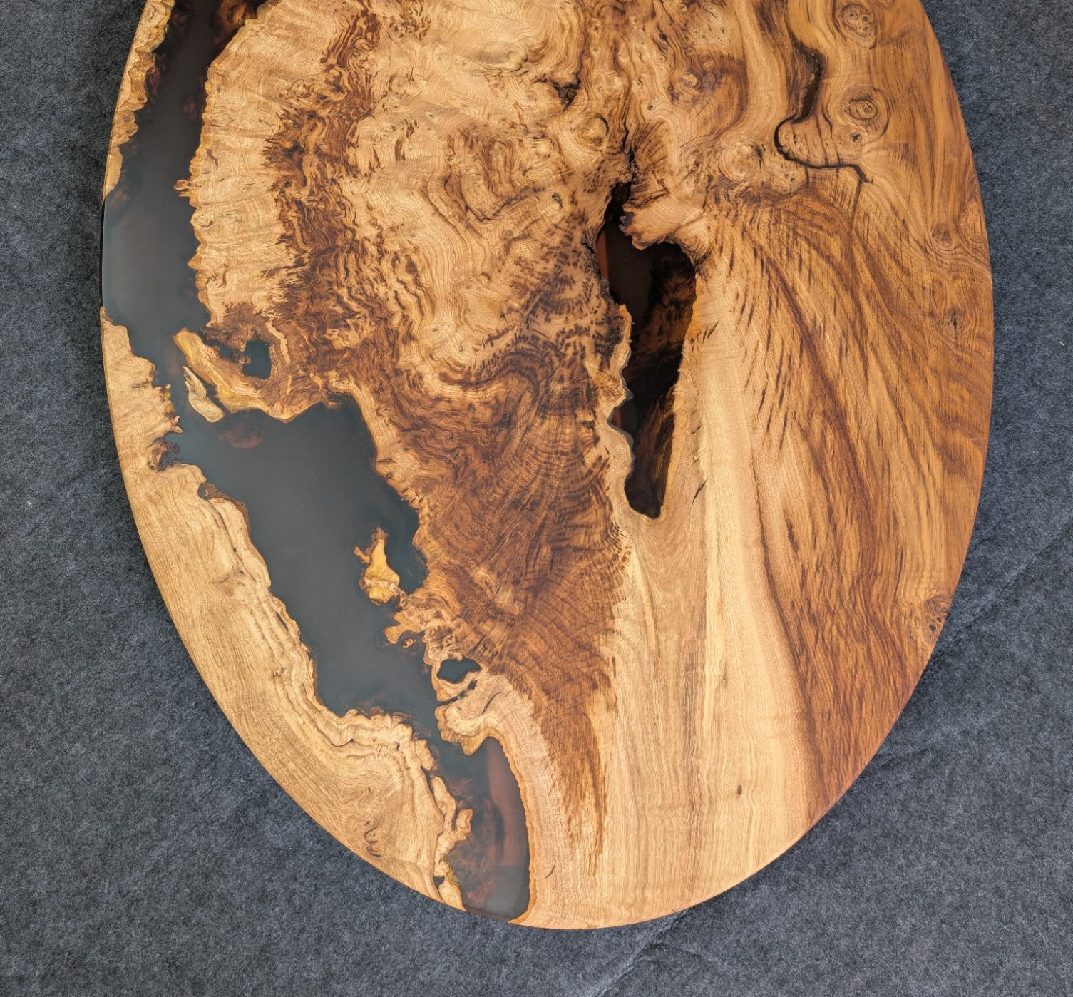 Confluence Chestnut and resin oval coffee table hand made in Northern Ireland